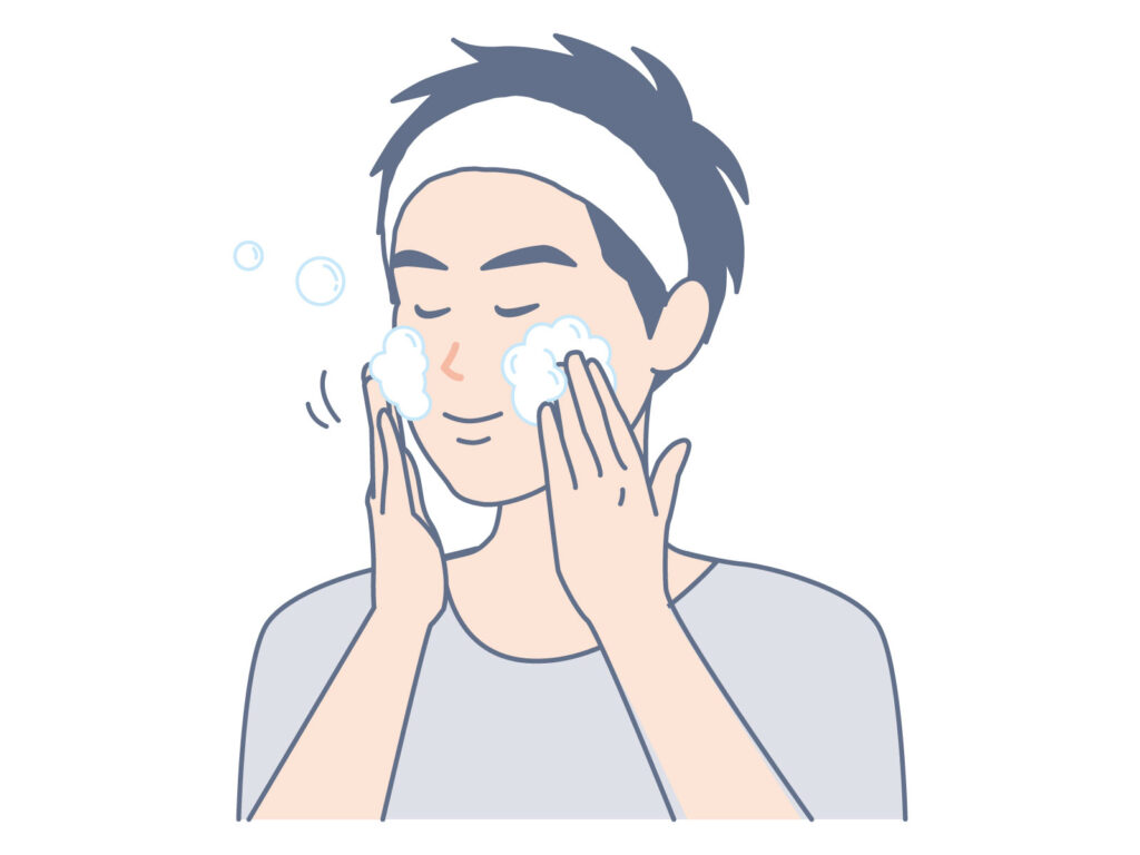 男性が泡立てた洗顔料で優しく顔を洗っている様子のイラスト