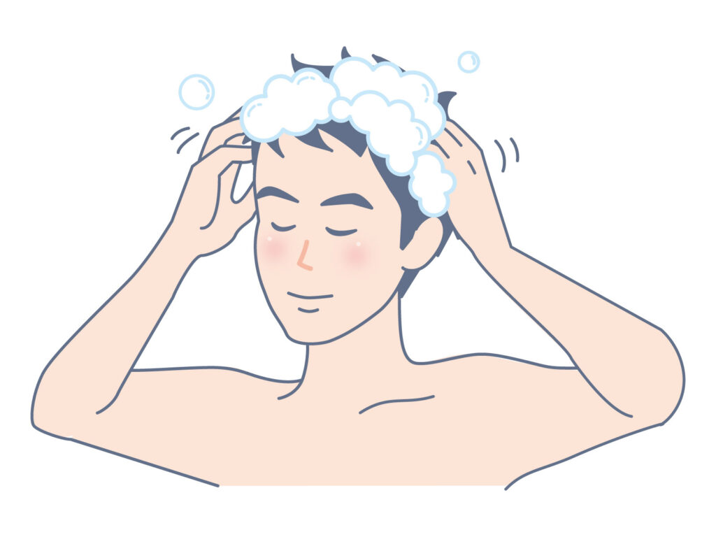 男性が目を瞑ってしっかりと泡を立てて髪の毛をシャンプーで洗っている様子のイラスト