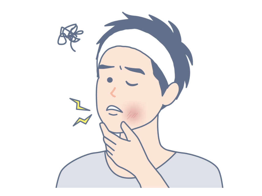 男性が剃刀負けで頬が赤く痛がっている様子のイラスト